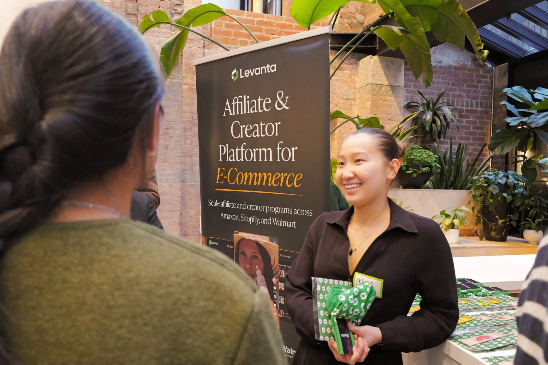 A Levanta rep engaging a founder in front of the Levanta brand banner