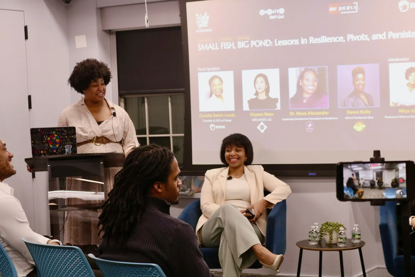 Founders laughing together at an Ugly Talk panel
